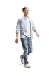 © Ljupco Smokovski - Full length shot of a happy young man in jeans and shirt walking