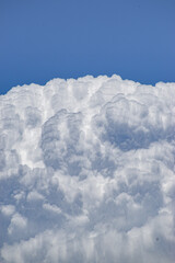 Wall Mural - vertical shot of the beautiful cloudscape in the blue sky.