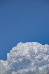 Wall Mural - vertical shot of the beautiful cloudscape in the blue sky.