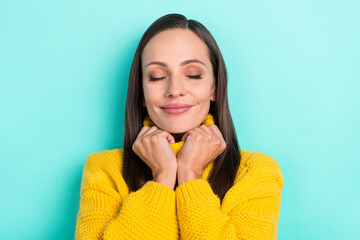 Wall Mural - Photo of charming shiny lady dressed yellow pullover arms collar closed eyes isolated teal color background