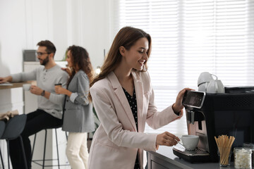 Sticker - Woman preparing fresh aromatic coffee with modern machine in office