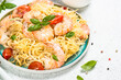 Pasta seafood with shrimp on white table.