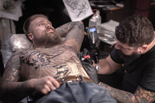 Tattoo Master Posing In His Salon