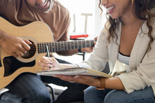 Close Up Couple With Guitar Song Writing