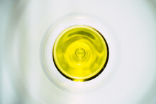 Closeup Shot Of A Yellow Circle On The Ground Of A Wine Glass