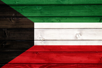 Flag of Kuwait on wooden surface
