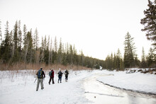 Friends On Winter Hike In Snowy Forest