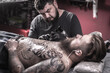 © Mr. Prof - Master tattooist demonstrates the process of getting tattoo