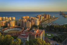 Aerial View Of Malaga City Under The Sunset On The Coast