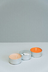 Canvas Print - Closeup of decorative candles on a gray background