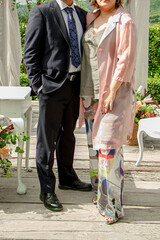 Canvas Print - Vertical shot of an unrecognizable male and a female posing at a wedding