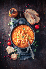 Wall Mural - Delicious minestrone soup served with whole grain bread.