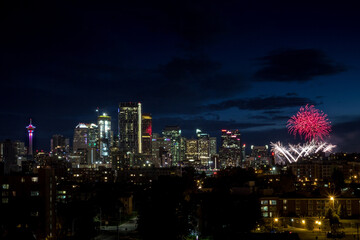 Sticker - Colorful Canada Day fireworks next to skyline buildings at night