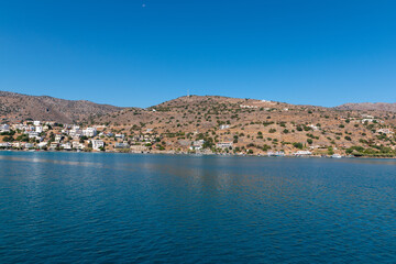 Sticker - View of the hilly shoreline of Crete island across the peaceful sea, Greece