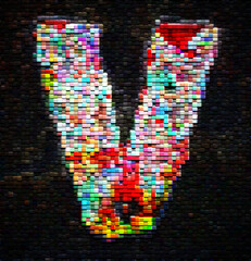 The letter V made up of thousands of color blocks 