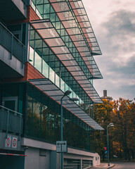 Canvas Print - Beautiful view of a modern building with reflective windows on a cloudy day