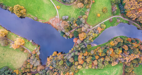 Top down view over Park, Pond and Gardens from a drone in the colors of fall, Exeter, Devon, England, Europe