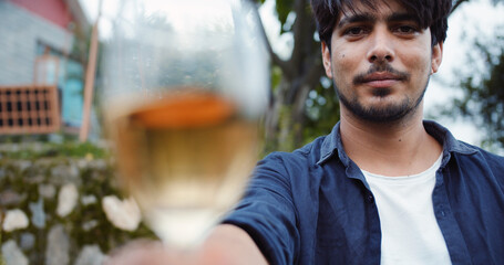 Wall Mural - Closeup portrait of the young man with a drink.