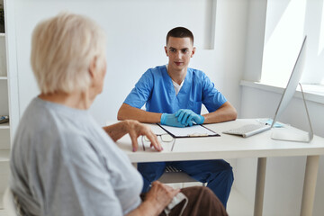 Sticker - elderly woman patient talking to doctor health care