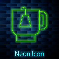 Sticker - Glowing neon line Cup of tea with tea bag icon isolated on brick wall background. Vector