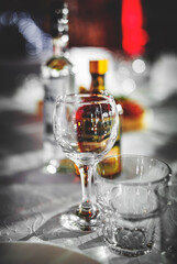 table in a restaurant with white tablecloth and empty glasses