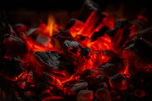 Hot Coals In The Fire On A Black Background. Beautiful Abstract Background On The Theme Of Fire, Light And Life.