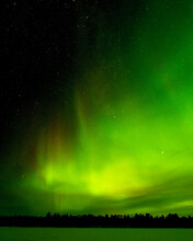 Aurora Borealis, Or Northern Lights At Lake Inari, Finnish Lapland