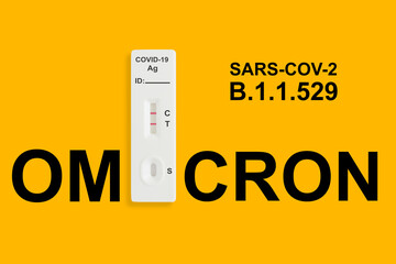 Rapid antigen test kit with positive result during swab COVID 19 testing. Covid 19 omicron variant outbreak around the world