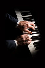 Pianist Plays Chord On Piano With Both Hands. Touches Gently The Keyboard. White, Male, Mature Hands. 