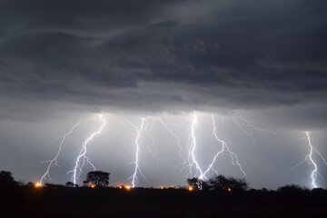Wall Mural - scenic view of a thunderstorm over dibeng information settlement, near deben, south africa