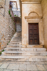 Narrow old town street at Sibenik city, Croatia. Famous tourist destination.