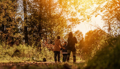 Poster - mother and two children walking in the forest