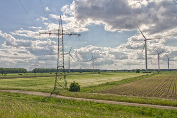 Canvas Print - Overhead and wind power in the field