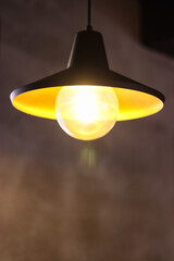 hanging lamp. lamp on the wall. chandelier in the room. lamp close-up. lamp with yellow light