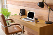 © Pixel-Shot - Modern minimal interior of workplace with laptop near wooden wall
