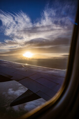 Canvas Print - Vertical view of the sunset from the airplane