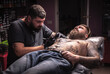 © Mr. Prof - Tattooist makes tattoo pictures in tattoo studio