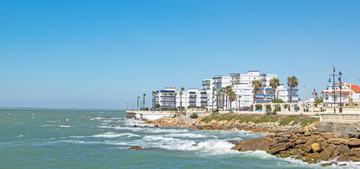 Waves breaking on the rocks of a beach in Chipiona, Cadiz, Andalusia, Spain