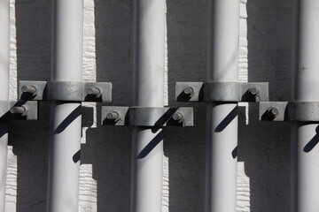 Sticker - Closeup of a Conduit and clamp for electric cable installation