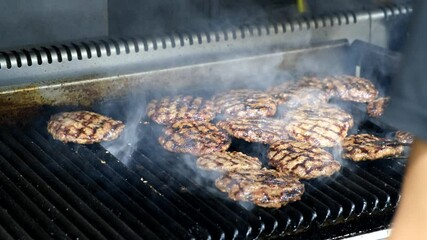 Poster - A closeup of a cook frying meat