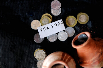 Sticker - Closeup of coins and clay jugs with a small piece of paper with a message.