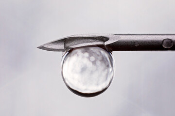 Wall Mural - Beautiful shot of a waterdrop from a needle