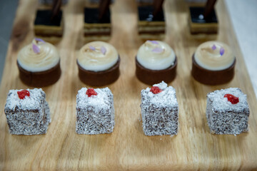 Sticker - Close-up shot of various dessert on a wooden surface