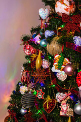 Canvas Print - Vertical shot of beautiful decorations and ornaments hanging on a Christmas tree with lights