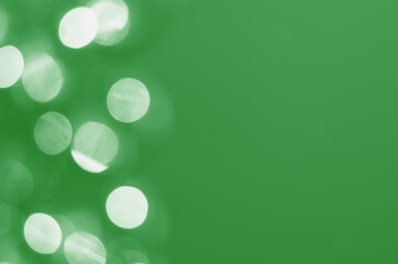 Wall Mural - defocused lights on a green background