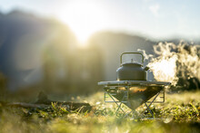 Selective Focus Shot Of A Boiling Coffeepot Outdoors