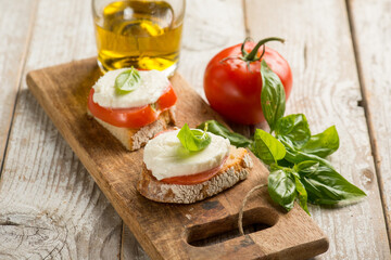 Poster - Caprese salad traditional italian recipe with mozzarella tomato basil and bread