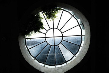 Wall Mural - Scenic shot of a circular window in the building in Tamarind Square, Malaysia