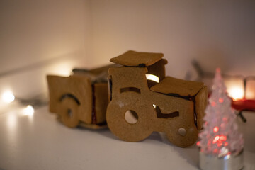 Wall Mural - View of a wooden toy train and Xmas tree decoration on the tabl