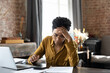 © fizkes - Unhappy frustrated young African American woman feeling stressed managing financial affairs or mistakes, suffering from lack of money calculating business expenditures, accounting, bankruptcy concept.